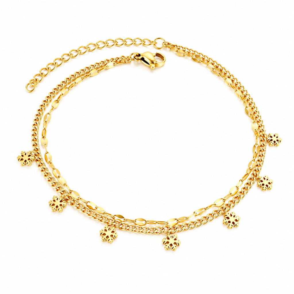 Layered snowflake charm anklet worn on ankle