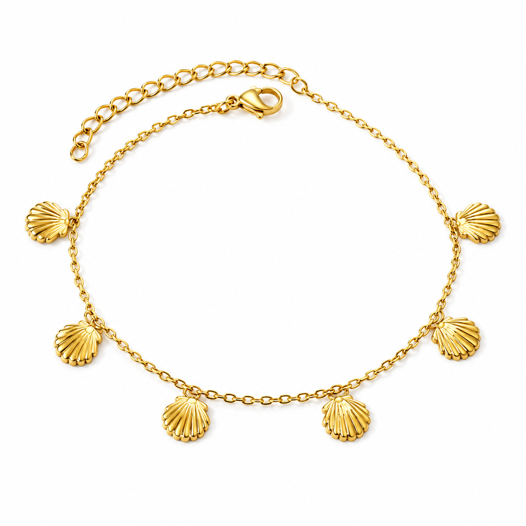 Gold-tone shell charm anklet worn around an ankle